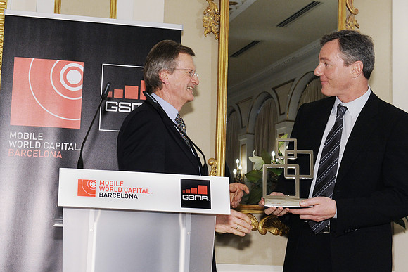 Dr Paul Jacobs, CEO & Chairman of Qualcomm Inc, receives the GSMA Chairman's Award for 2014 from Jon-Fredrik Baksaas, GSMA Chairman